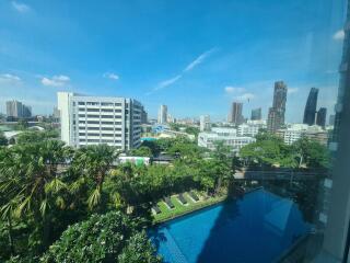 City view with pool and high-rise buildings