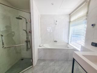 Modern bathroom with shower and bathtub