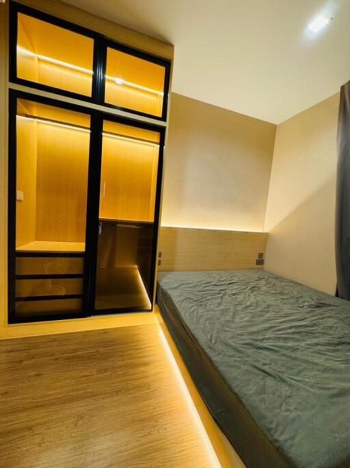 Modern bedroom with sleek wardrobe and bed