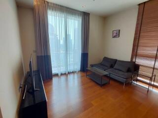 Living room with large window and city view