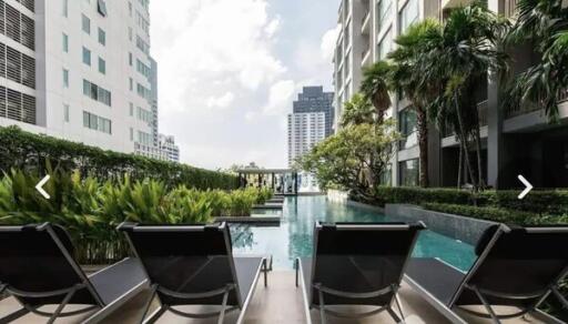 Luxurious outdoor pool area with lounge chairs