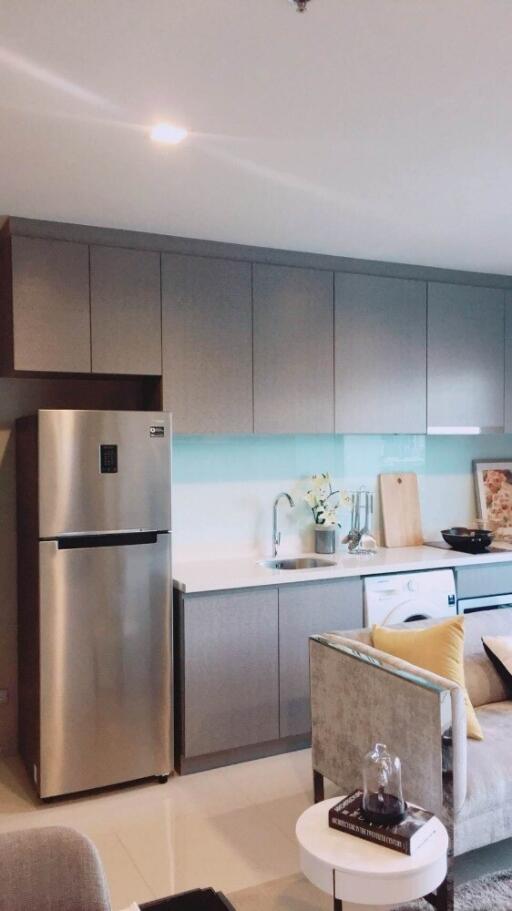 Modern kitchen with stainless steel appliances and light grey cabinets