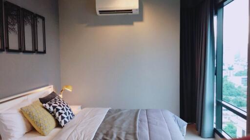 Modern bedroom with air conditioner and large window