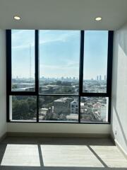 Living room with large windows and city view