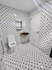 Modern bathroom with black and white tiles