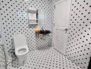 Modern bathroom with black and white tiles