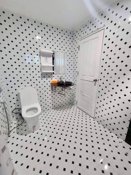 Modern bathroom with black and white tiles