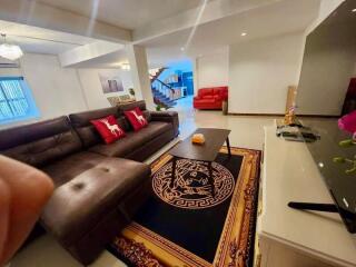 Modern living room with sectional sofa and vibrant decor