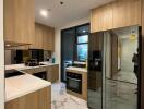 Modern kitchen with wooden cabinetry and marble floors