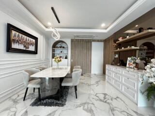 Modern dining area with elegant decor and marble flooring