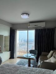 Living room with balcony and city view