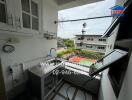 Balcony with a sink and storage cabinets