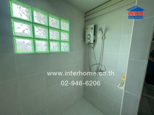 Bathroom with shower area and glass blocks
