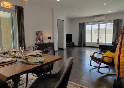 Spacious living and dining area with modern furnishings