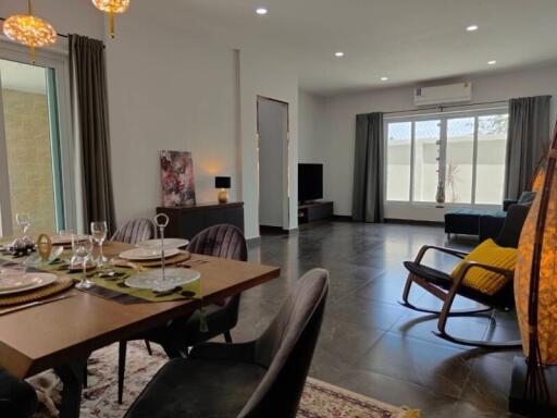 Spacious living and dining area with modern furnishings