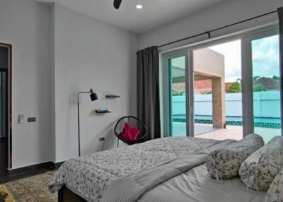 Modern bedroom with pool view