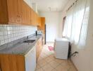 Modern kitchen with wooden cabinets and tiled backsplash