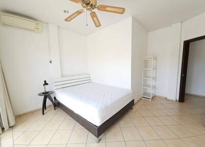 Bedroom with bed, ceiling fan, and air conditioning unit