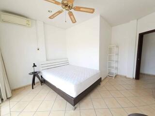 Bedroom with bed, ceiling fan, and air conditioning unit