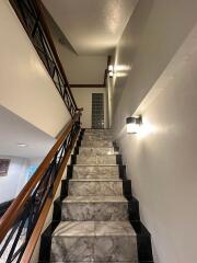 Elegant marble staircase with modern lighting