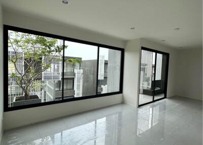 Spacious living room with large windows