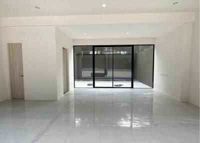 Spacious main living area with large windows and sliding glass doors