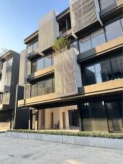 Modern multi-story residential building with large windows