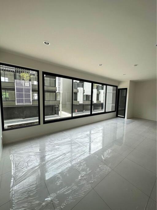 Spacious living room with large windows