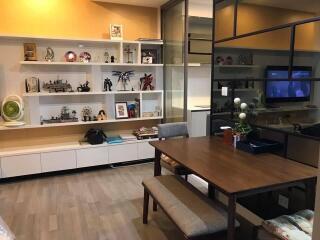 Living room with shelving and dining table