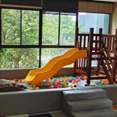 Indoor play area with slide and ball pit