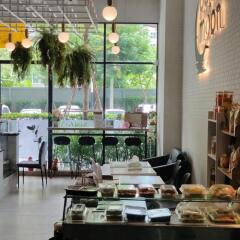 Modern café or dining area with natural light and greenery