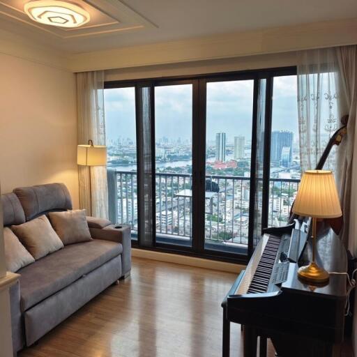 living room with city view and a sofa