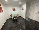 Modern dining room with glass table and artwork