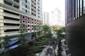 View of a residential and commercial building area with trees