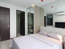 Modern and cozy bedroom with a double bed, mirrored closet, and ensuite bathroom