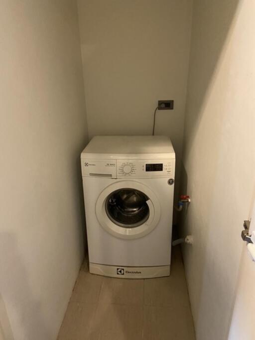 Compact laundry area with washing machine