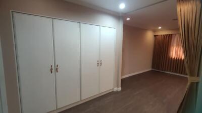 Spacious bedroom with built-in wardrobes