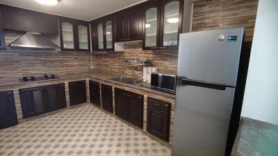 Spacious kitchen with modern appliances and ample storage