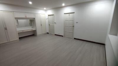 Spacious bedroom with built-in wardrobe and dressing area