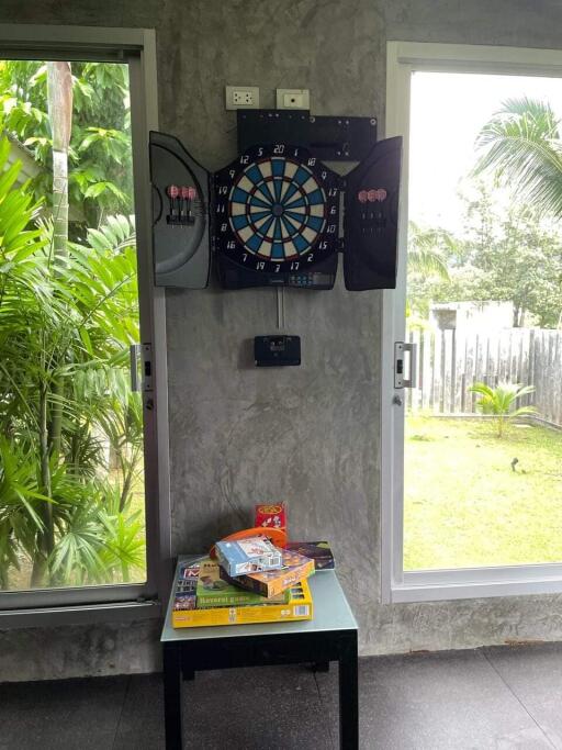 Outdoor view with a dartboard and small table