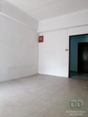 Empty room with door and white walls