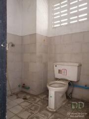 Bathroom with a toilet and shower area