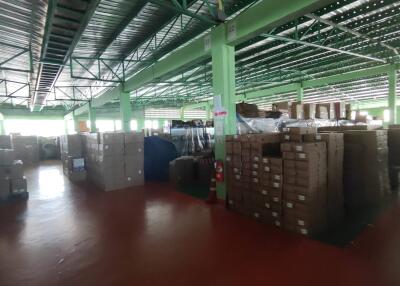 A large warehouse with stacks of boxes and storage materials.