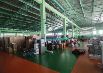 Interior view of a warehouse with boxes and shelves