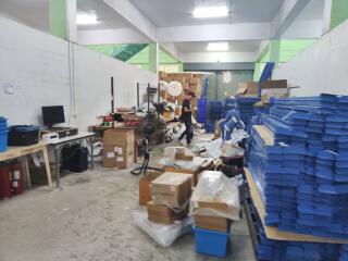 Warehouse storage area with various items and equipment