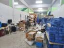 Warehouse storage area with various items and equipment