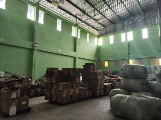 Interior of a warehouse with stacked packages and materials