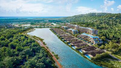 Aerial view of luxurious waterfront properties surrounded by lush greenery
