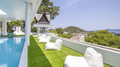 Luxury poolside lounge area with scenic views