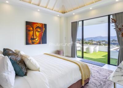 Modern bedroom with wall art and large windows